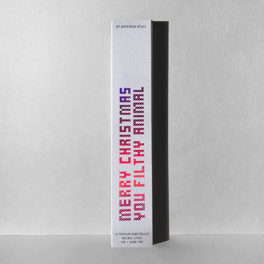 Bohemian Rêves Merry Christmas You Filthy Animal incense box on light gray background